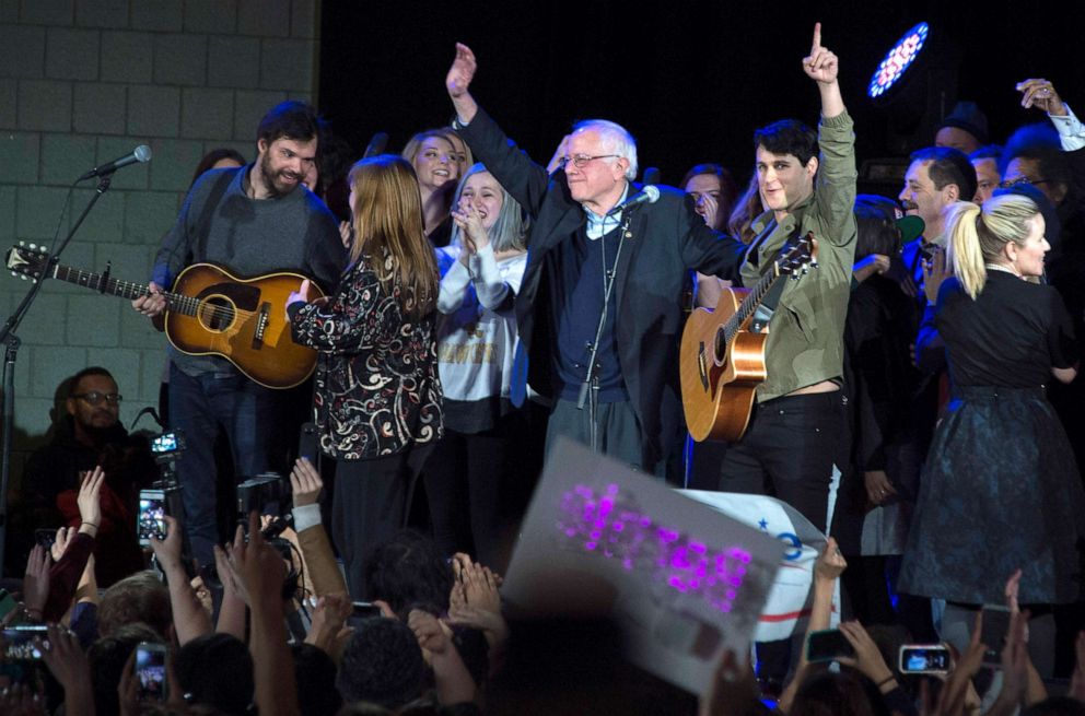 PHOTO: Democratic presidential candidate Bernie Sanders stands with rock band Vampire Weekend's lead singer Ezra Koenig, right, after speaking at the University of Iowa in Iowa City, Iowa, Jan. 30, 2016, ahead of the Iowa Caucus.