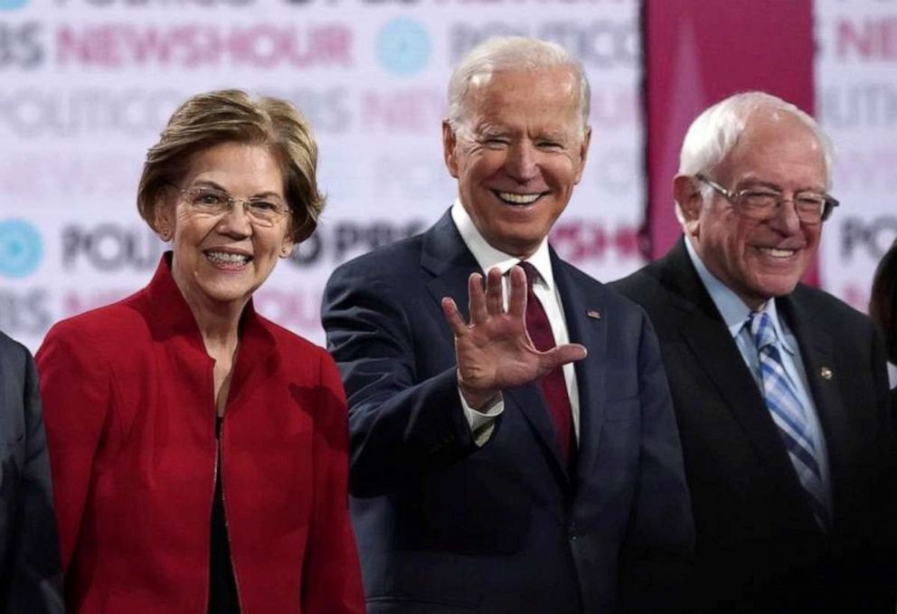 PHOTO: Democratic presidential candidates Sen. Elizabeth Warren, former Vice President Joe Biden and Sen. Bernie Sanders stand onstage before the start of the debate at Loyola Marymount University in Los Angeles, on Dec. 19, 2019.