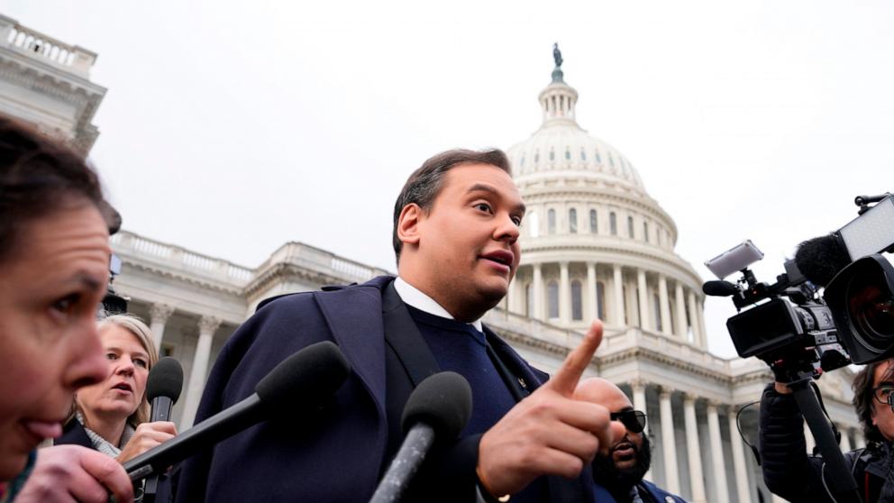 PHOTO: Rep. George Santos is surrounded by journalists as he leaves the Capitol after his fellow members of Congress voted to expel him from the House of Representatives, Dec. 1, 2023.