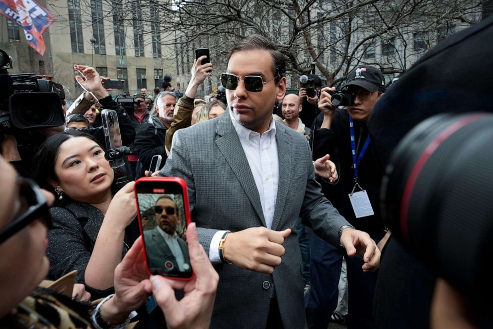 PHOTO: Rep. George Santos walks through the crowd gathered outside the courthouse where former President Donald Trump will arrive later in the day for his arraignment on April 4, 2023, in New York City.
