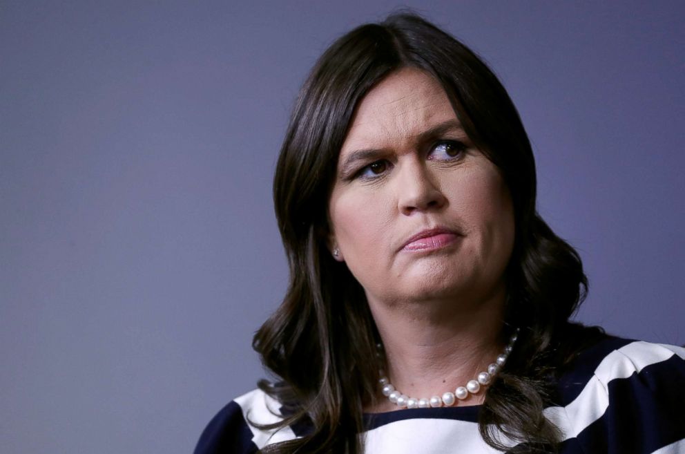 PHOTO: White House press secretary Sarah Huckabee Sanders listens to Health and Human Services Secretary Alex Azar answer questions from the news media during the daily briefing at the White House in Washington, D.C., May 11, 2018.