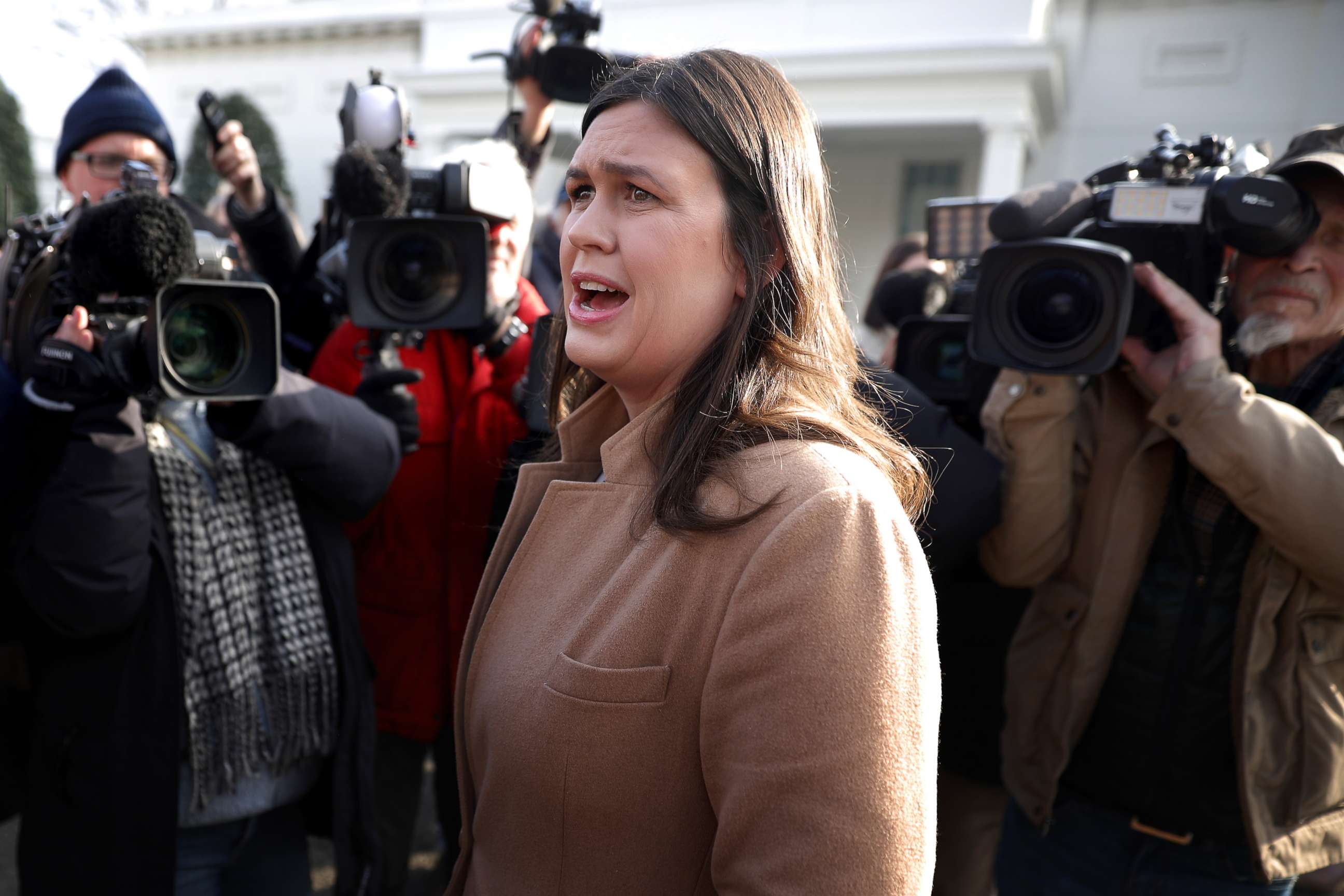 PHOTO: White House Press Secretary Sarah Huckabee Sanders talks to reporters outside the West Wing of the White House, Jan. 18, 2019.