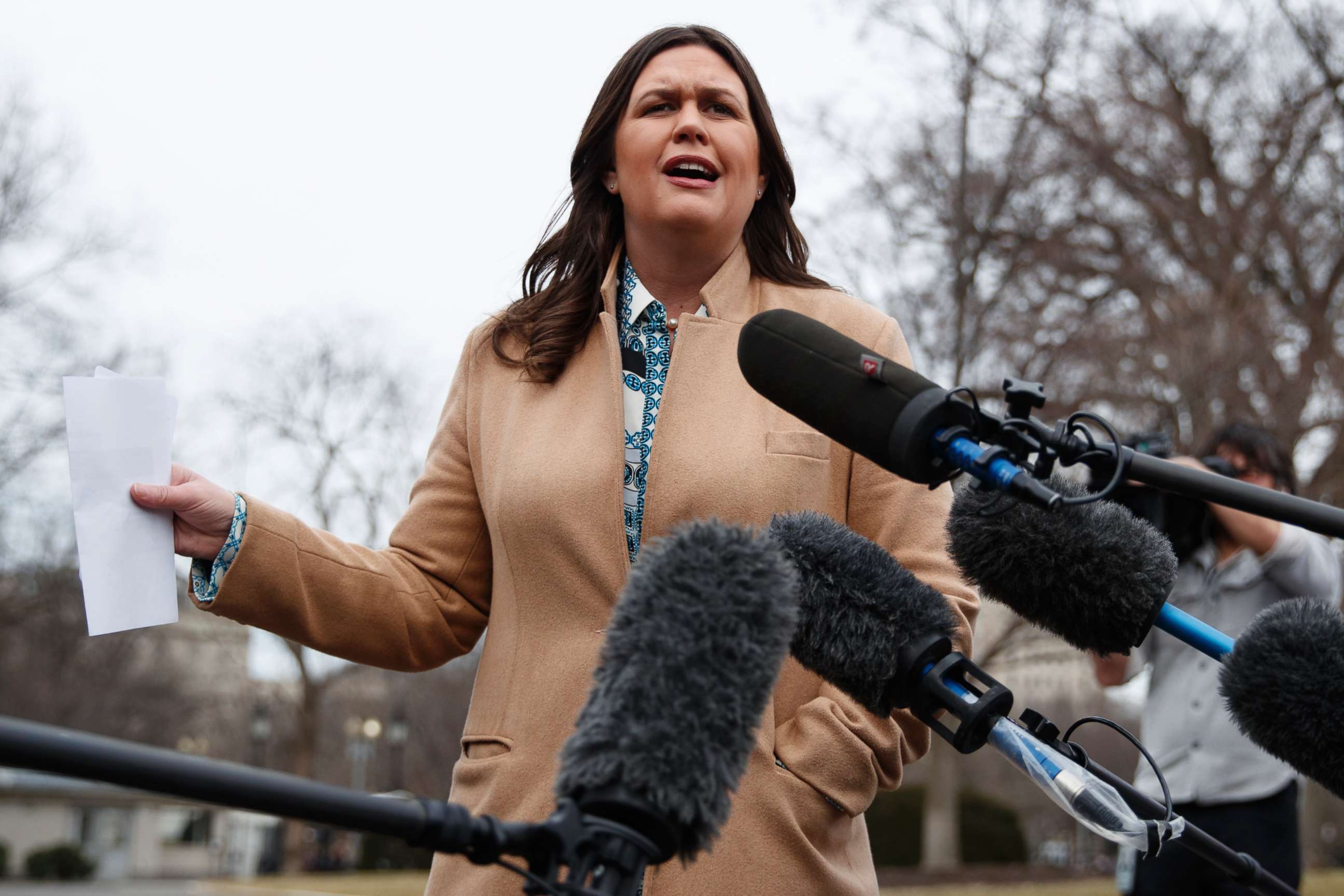 PHOTO: White House press secretary Sarah Sanders talks with reporters outside the White House in Washington, Feb. 15, 2019.