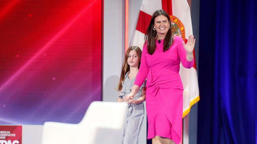 PHOTO: Former White House Press Secretary Sarah Huckabee Sanders walks on stage with her daughter Scarlett Sanders while attending the Reagan dinner at the Conservative Political Action Conference (CPAC) in Orlando, Fla., Feb. 27, 2021.