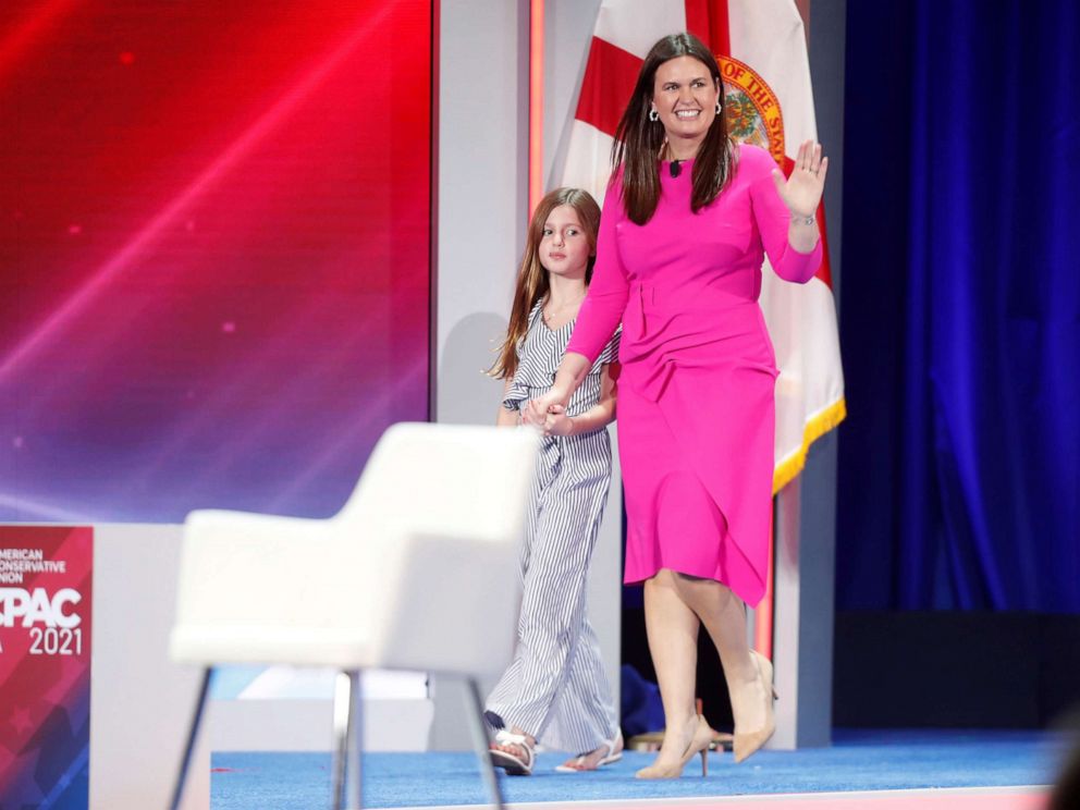 PHOTO: Former White House Press Secretary Sarah Huckabee Sanders walks on stage with her daughter Scarlett Sanders while attending the Reagan dinner at the Conservative Political Action Conference (CPAC) in Orlando, Fla., Feb. 27, 2021.