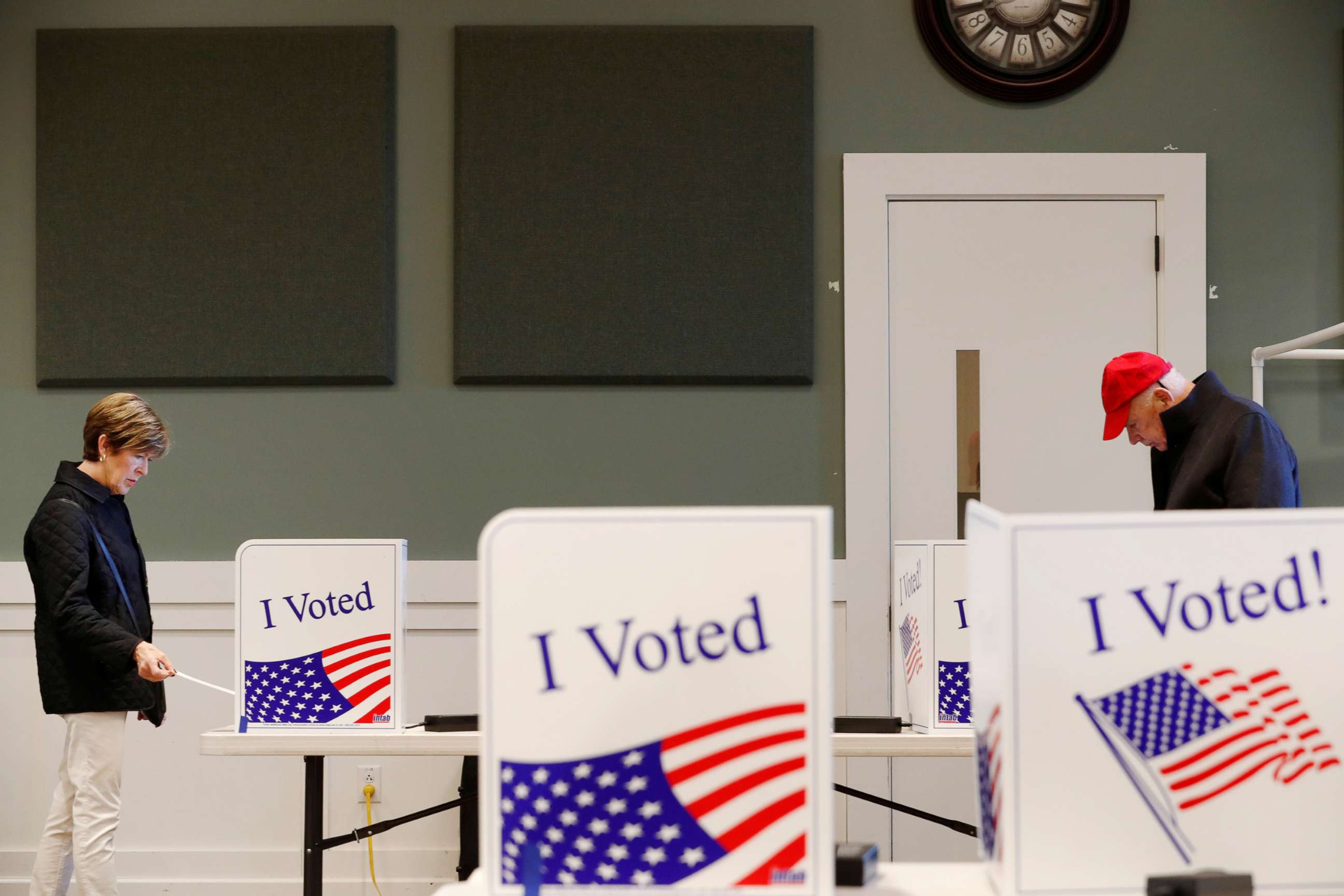 PHOTO: Two voters cast their ballot at a polling station for the South Carolina Democratic presidential primary in Fort Mill, S.C., Feb. 29, 2020.