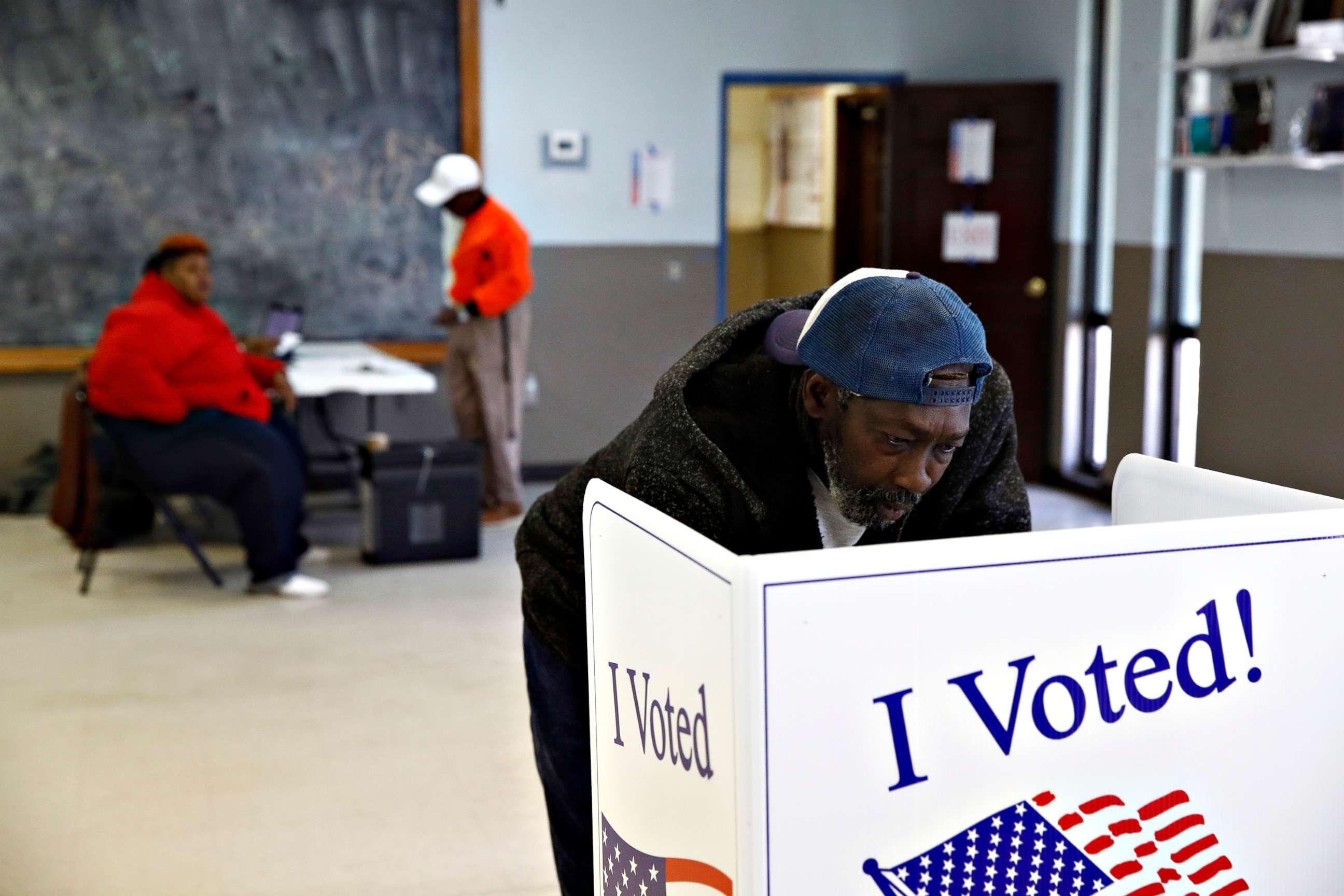 PHOTO: John Singleton fills out his ballot at a polling station for the Democratic presidential primary, in Charleston, S.C., Feb. 29, 2020.