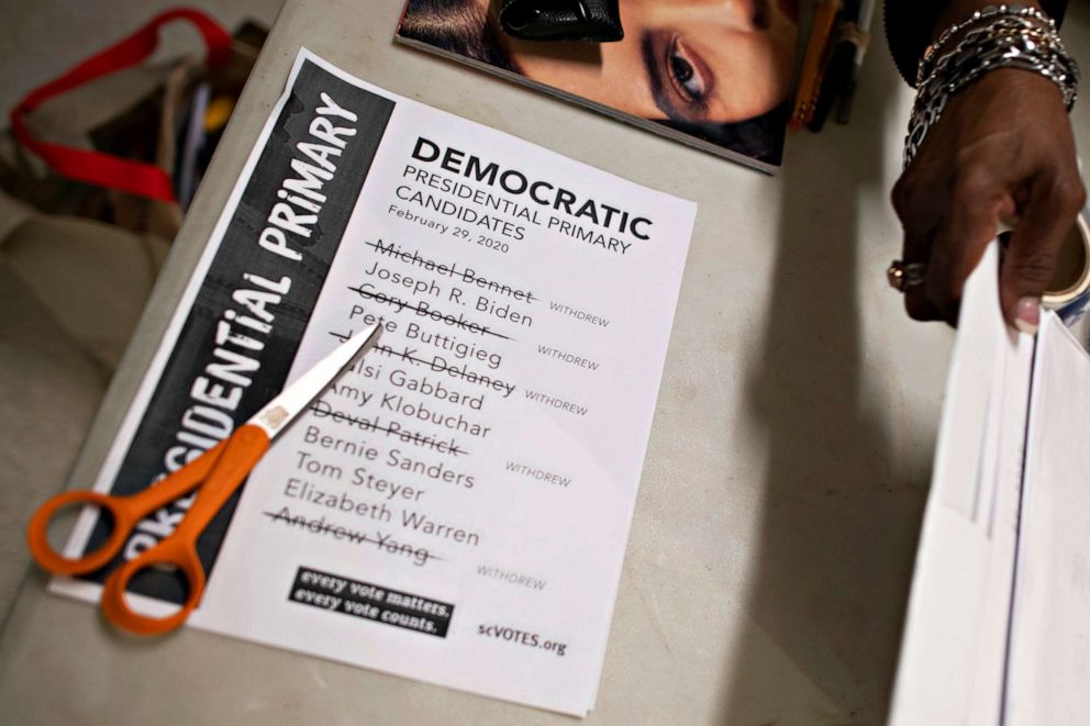PHOTO: Scissors rest atop a notice alerting voters as to the remaining Democratic presidential primary candidates on the day of the South Carolina primary at a polling location, in Spartanburg, S.C., Feb. 29, 2020.