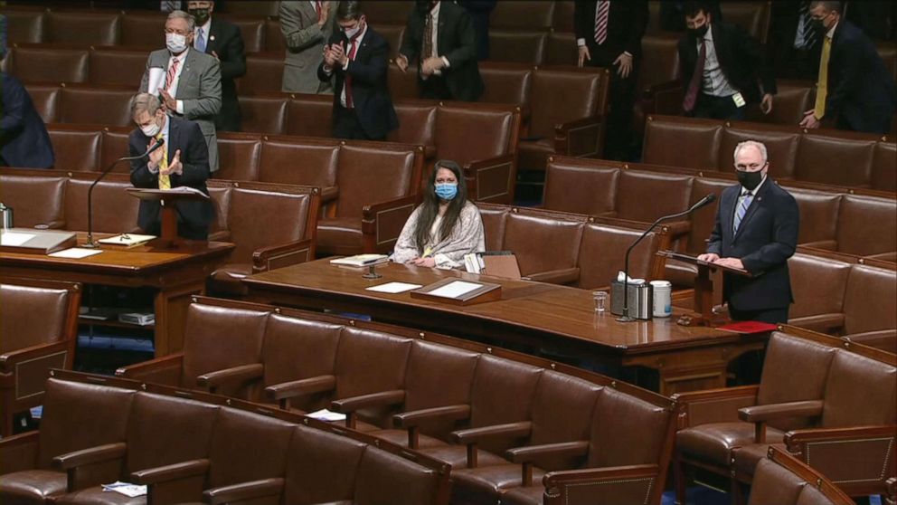 PHOTO: House Minority Whip Steve Scalise, right, is applauded on the House floor during the debate on the impeachment charges against President Donald Trump, Jan. 13, 2021, at the U.S. Capitol.