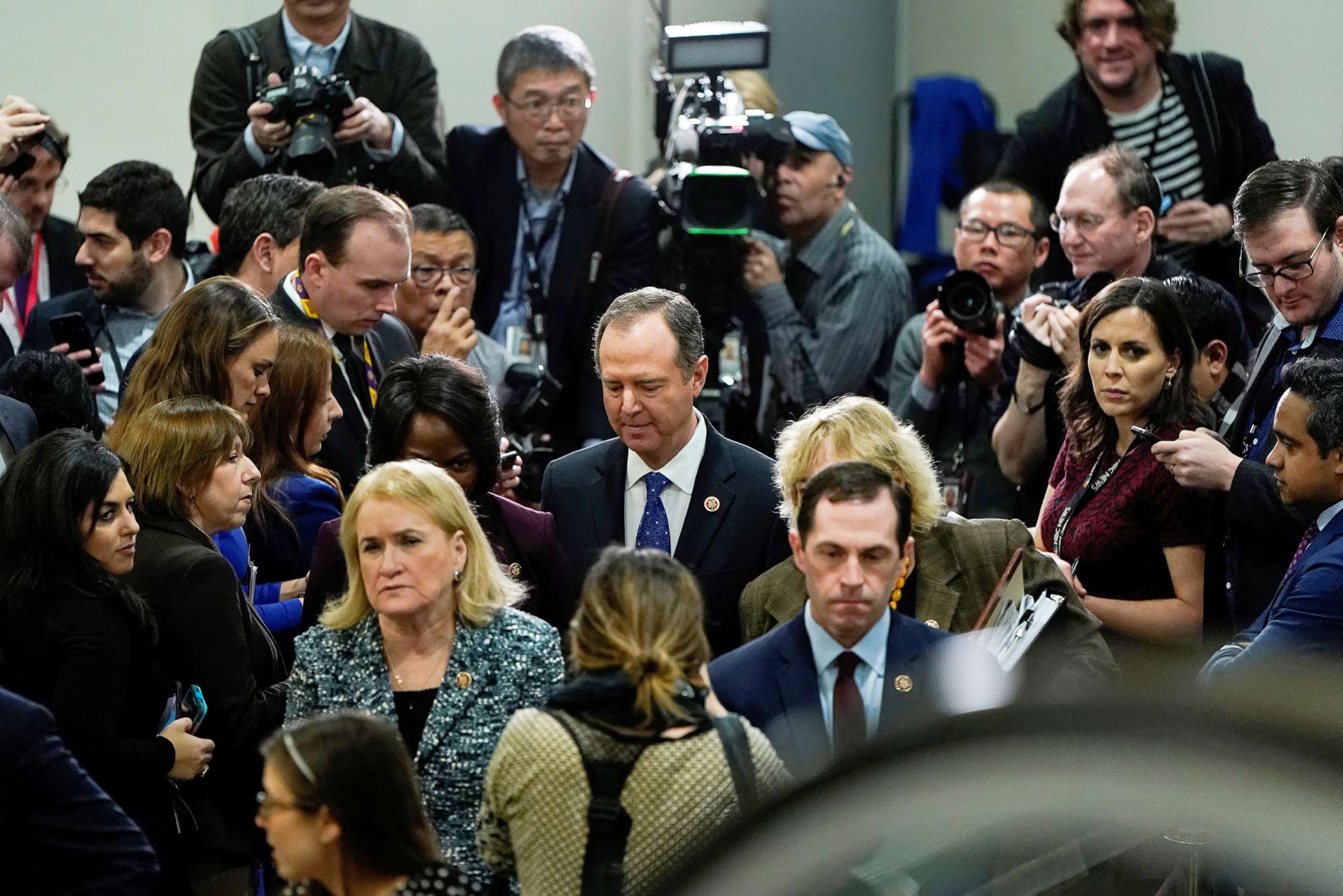 PHOTO: Rep. Adam Schiff, center, walks after speaking to the media in Washington, Jan. 27, 2020.