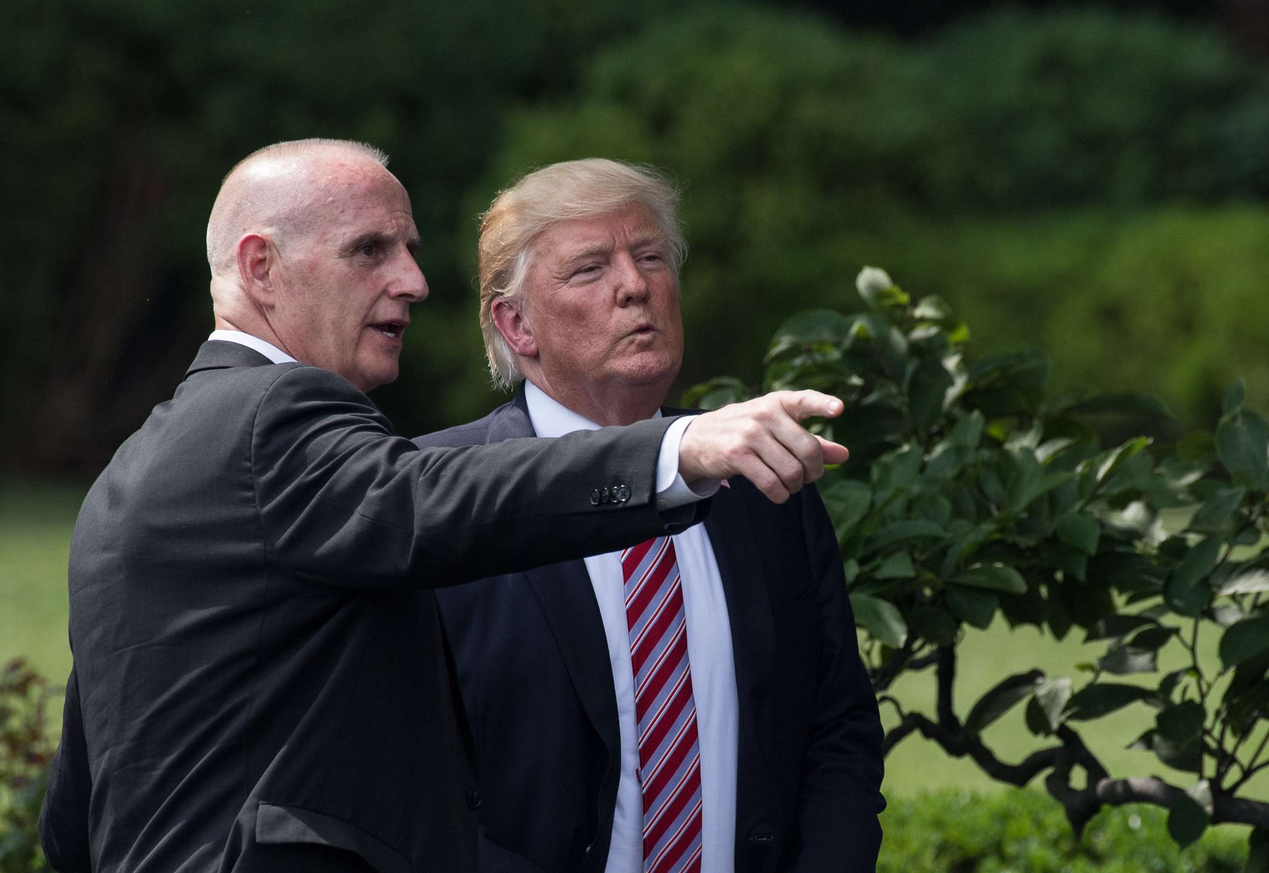 PHOTO: President Donald Trump listens to Director of Oval Office Operations Keith Schiller as he prepares to leave after welcoming the Clemson Tigers, the 2016 NCAA Football National Champions, at the White House in Washington, June 12, 2017. 