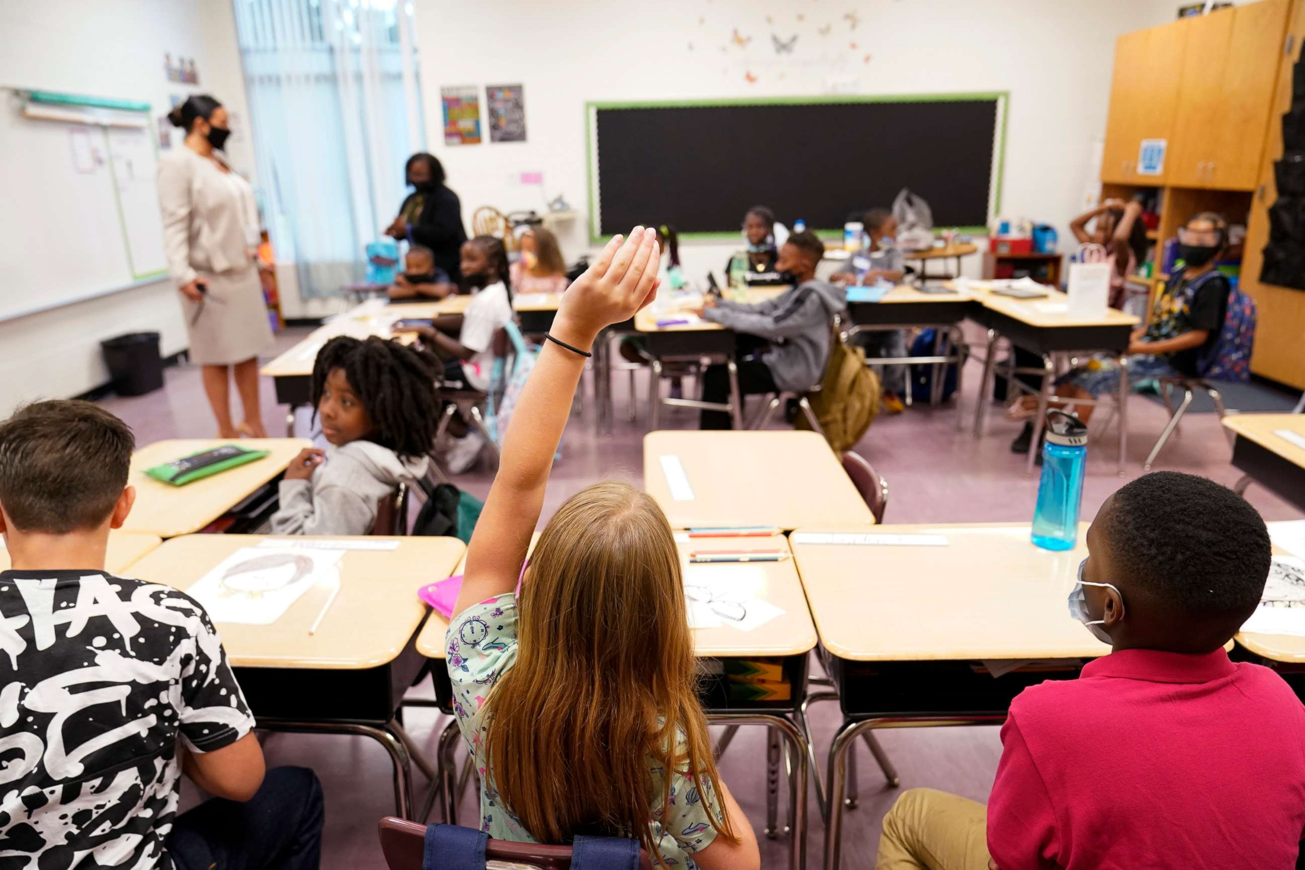 PHOTO: A student raises their hand in a classroom at Tussahaw Elementary School on Aug. 4, 2021, in McDonough, Ga.