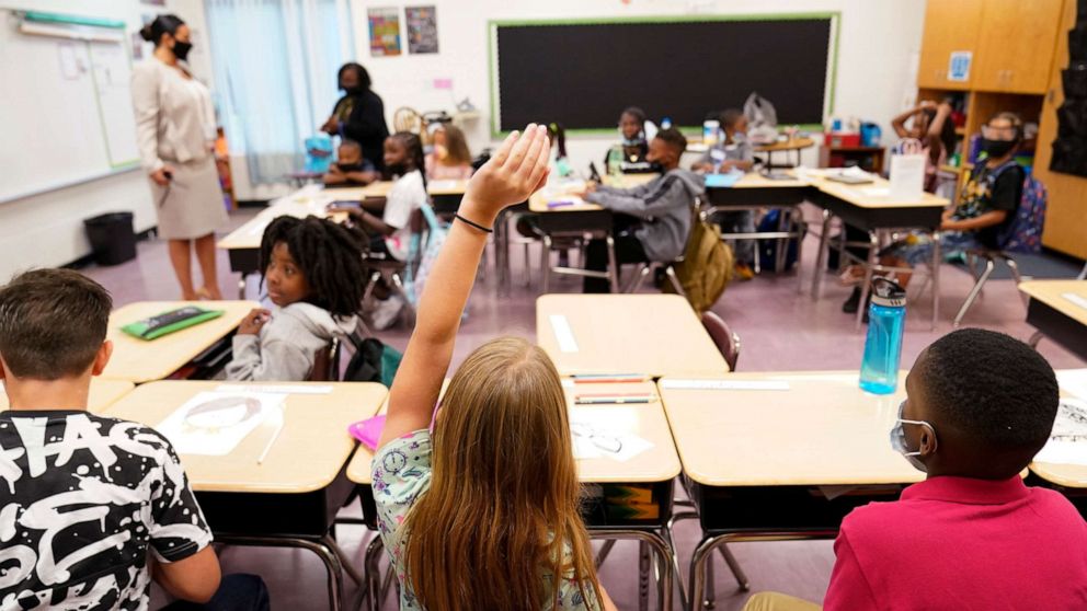 PHOTO: A student raises their hand in a classroom at Tussahaw Elementary School on Aug. 4, 2021, in McDonough, Ga.