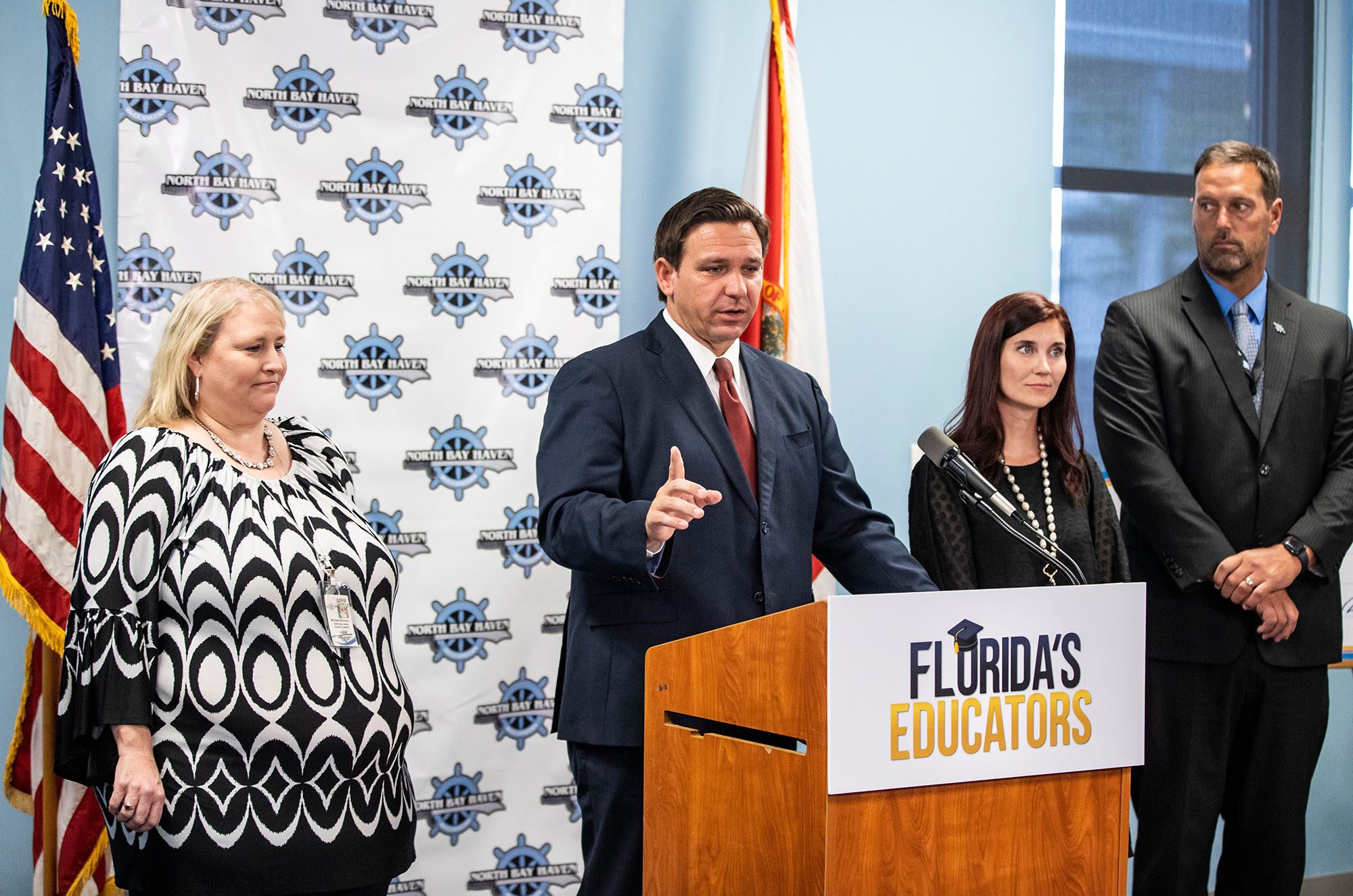 PHOTO: Florida Gov. Ron DeSantis holds a press conference and hands out $1000 checks to teachers at North Bay Haven Charter Academy in Panama, Fla., Aug. 11, 2021.