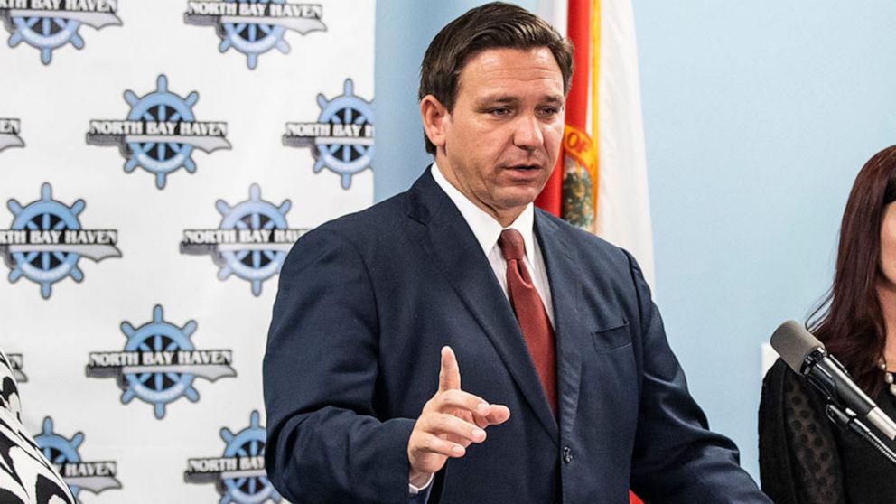 PHOTO: Florida Gov. Ron DeSantis holds a press conference and hands out $1000 checks to teachers at North Bay Haven Charter Academy in Panama, Fla., Aug. 11, 2021.