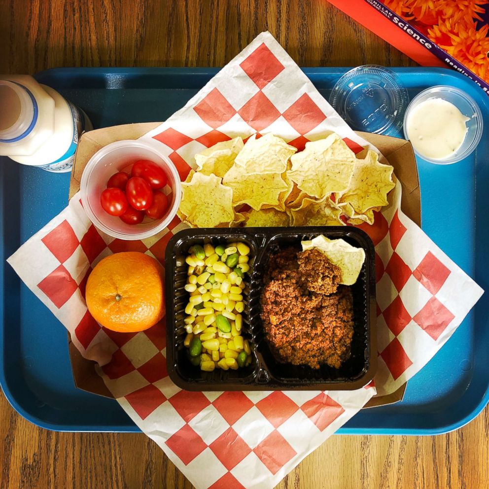 PHOTO: Homemade taco, tortilla chips, corn and edamame, grape tomatoes, ranch dressing, clementine & 1% milk make up a student meal at at an elementary school in Silver Spring, Md., Feb. 12, 2018.