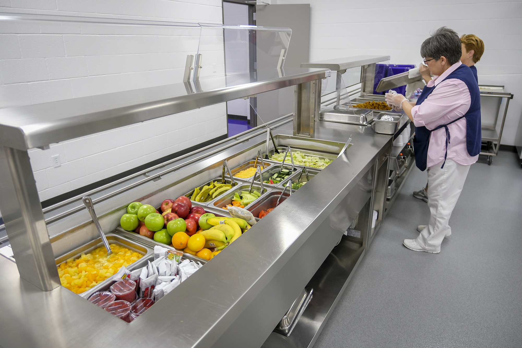 PHOTO: Michelle Hughes, head cook at Harrisburg High School, readies the serving line for lunch at the school on Feb. 14, 2019, in Harrisburg, Ill.