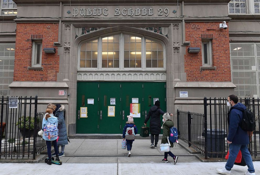PHOTO: Children arrive for class on the first day of school reopening on Dec. 7, 2020 in Brooklyn, New York.