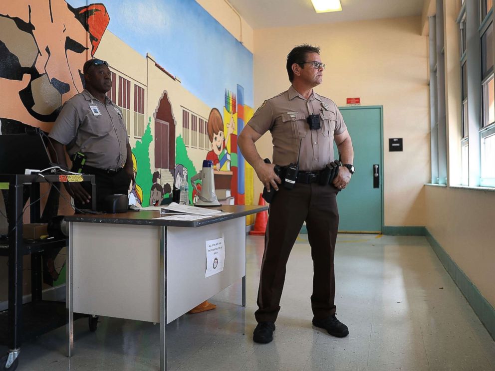 PHOTO: School security officers guard the the front entrance to the Kenwood K-8 Center in Miami, Fla., Aug. 24, 2018.