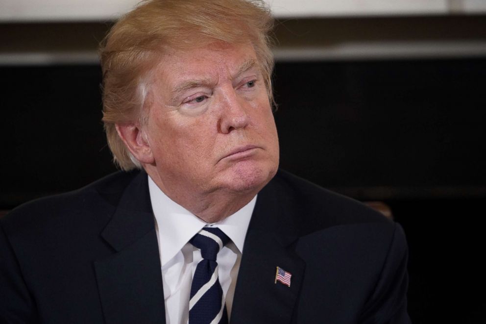 PHOTO: President Donald Trump takes part in a listening session on gun violence with teachers and students in the State Dining Room of the White House on Feb. 21, 2018.