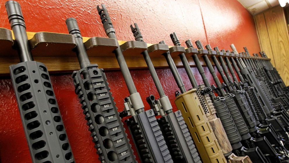 PHOTO: A row of rifles for sale are displayed at a gun shop in Aurora, Colo., on July 20, 2012. 
