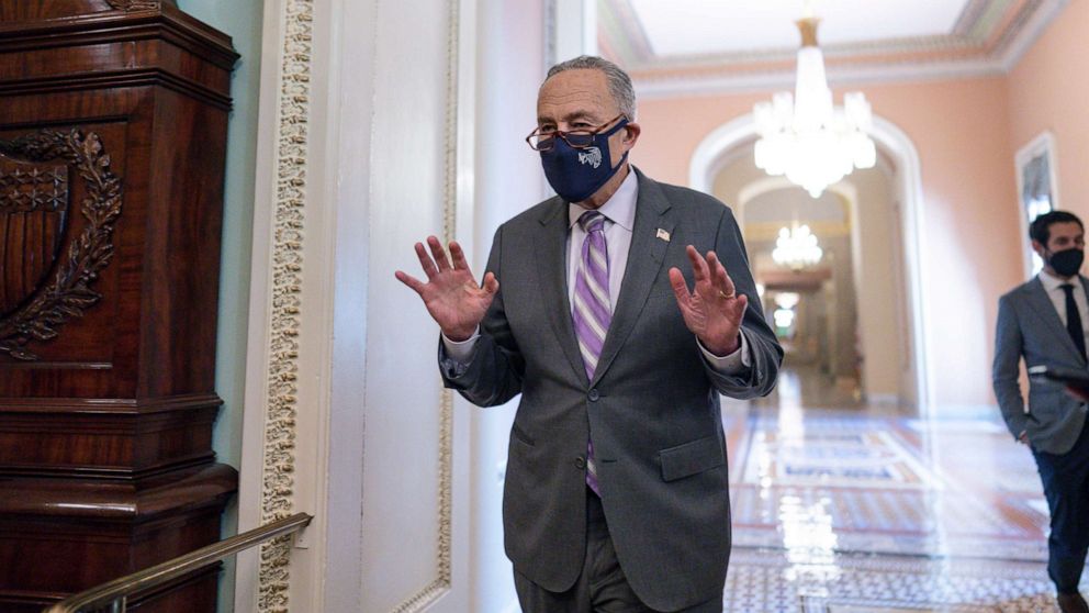 PHOTO: Senate Majority Leader Chuck Schumer emerges from a Democratic Caucus meeting as the Senate continues to grapple with end-of-year tasks at the Capitol, Dec. 16, 2021. 