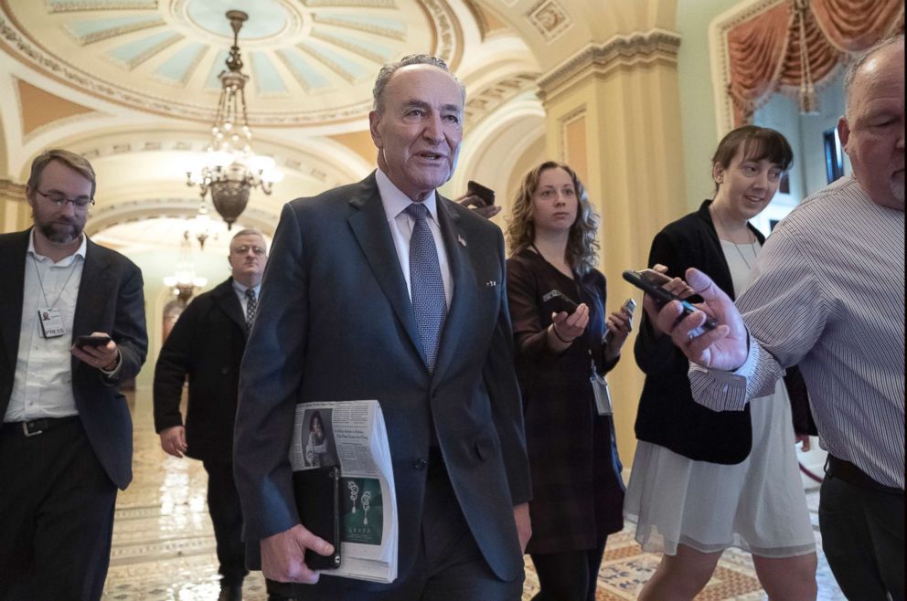 PHOTO: Senate Minority Leader Chuck Schumer, D-N.Y., is met by reporters as he arrives at the Capitol on the first morning of a partial government shutdown, Dec. 22, 2018.