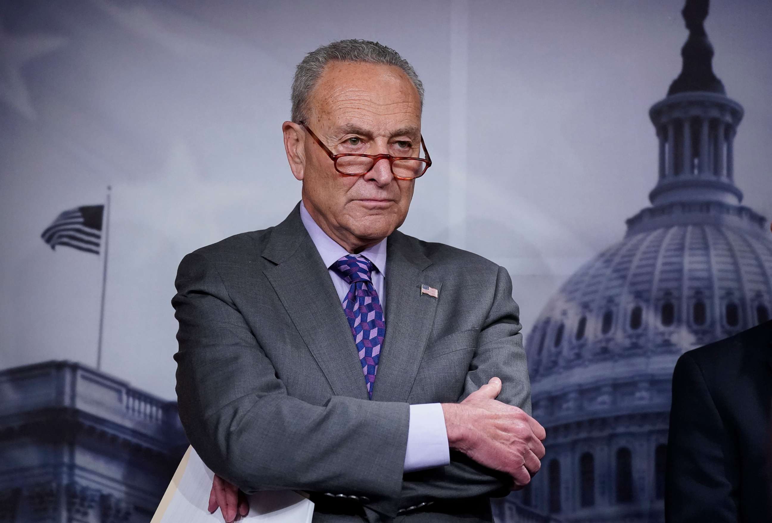 PHOTO: Senate Majority Leader Chuck Schumer listens during a news conference following a closed-door caucus lunch, at the Capitol in Washington, July 19, 2022.