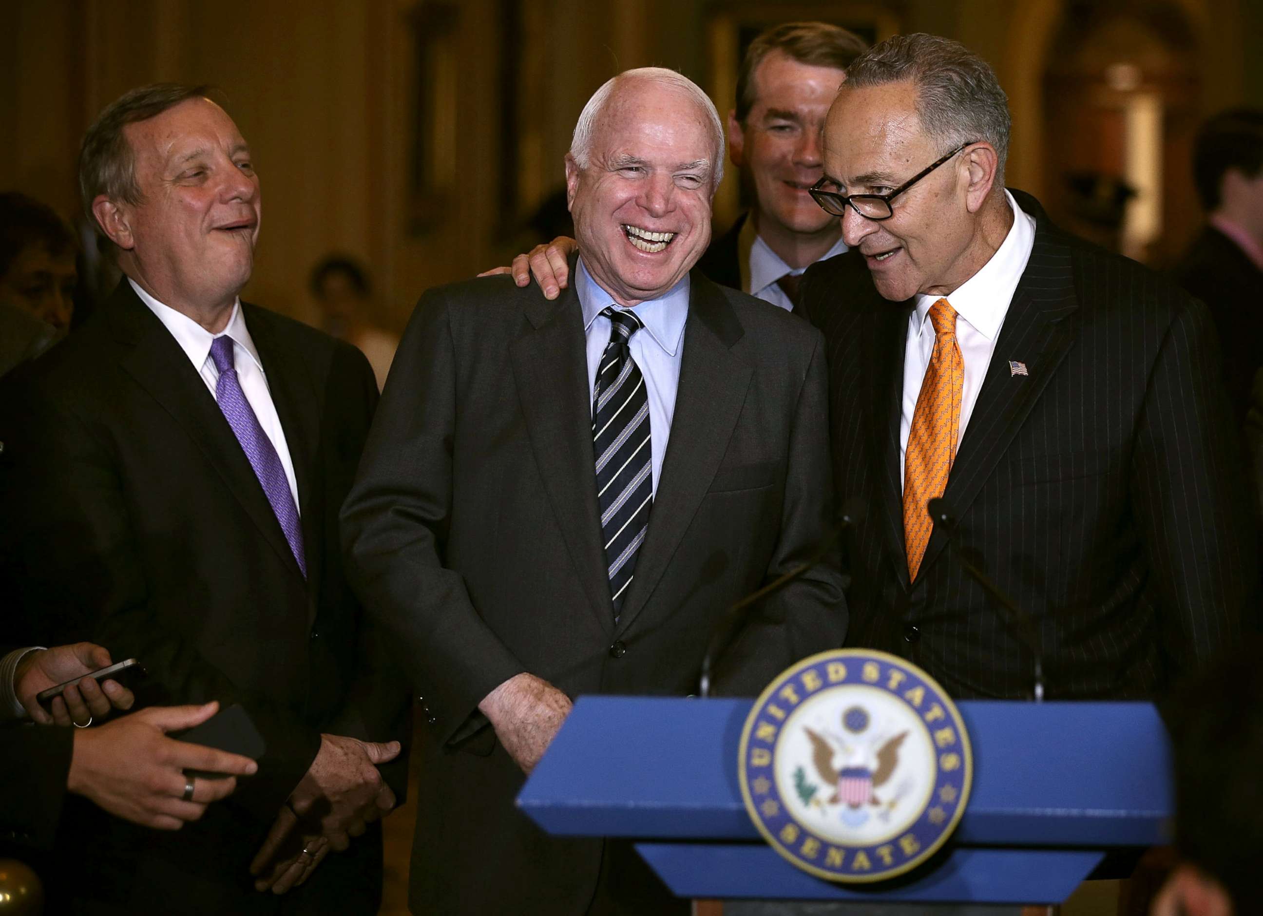 PHOTO: Sen. John McCain and Sen. Charles Schumer share a moment as they speak to members of the press outside the Senate Chamber, June 27, 2013, at the U.S. Capitol in Washington.