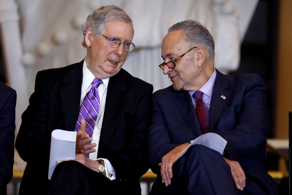 PHOTO: Senate Majority Leader Mitch McConnell and Senate Minority Leader Chuck Schumer, right, talk during a ceremony on Capitol Hill in Washington, D.C., Oct. 25, 2017.