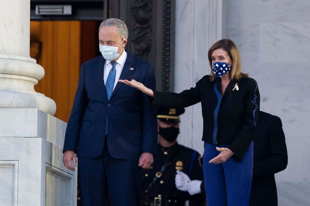 PHOTO: Speaker of the House Nancy Pelosi (R) and Senate Minority Leader Chuck Schumer (2-R)  at the East Front steps of the Capitol, July 27, 2020. 