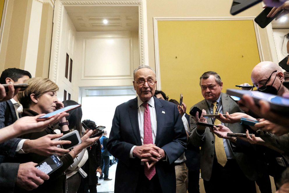 PHOTO: Senate Majority Leader Chuck Schumer speaks with members of the media before voting on legislation to avoid a nationwide rail strike on Capitol Hill December 1, 2022. 