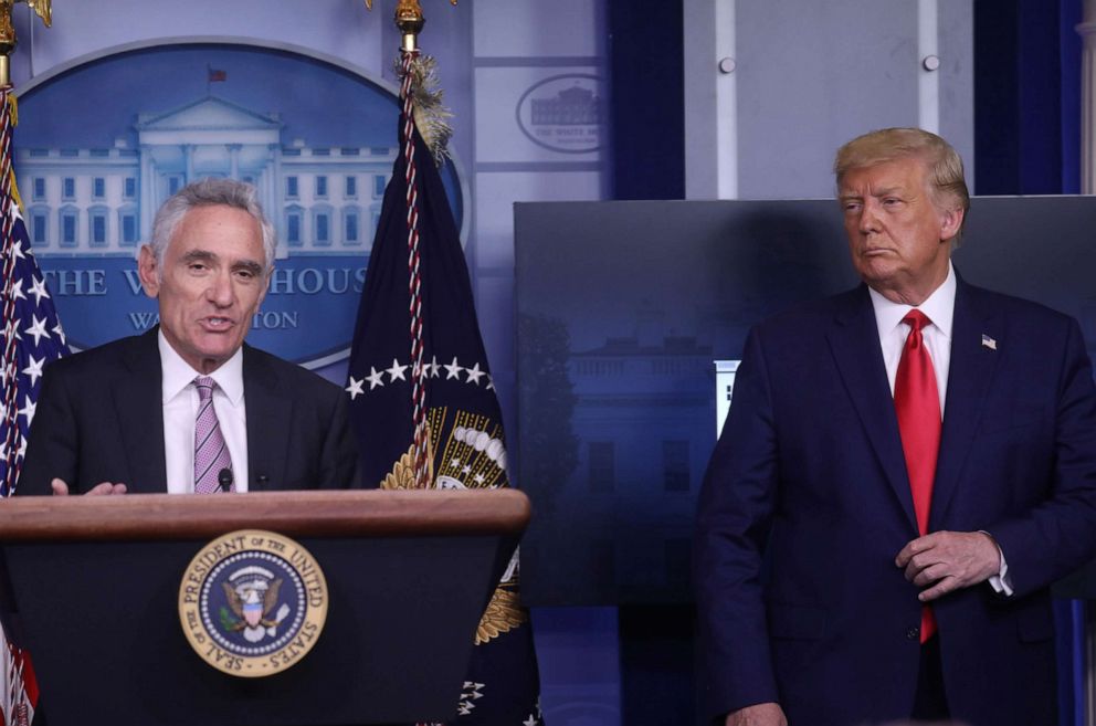 PHOTO: President Donald Trump listens as Dr. Scott Atlas speaks to reporters during a news conference in the Brady Press Briefing Room at the White House in Washington, DC., Sept. 16, 2020.