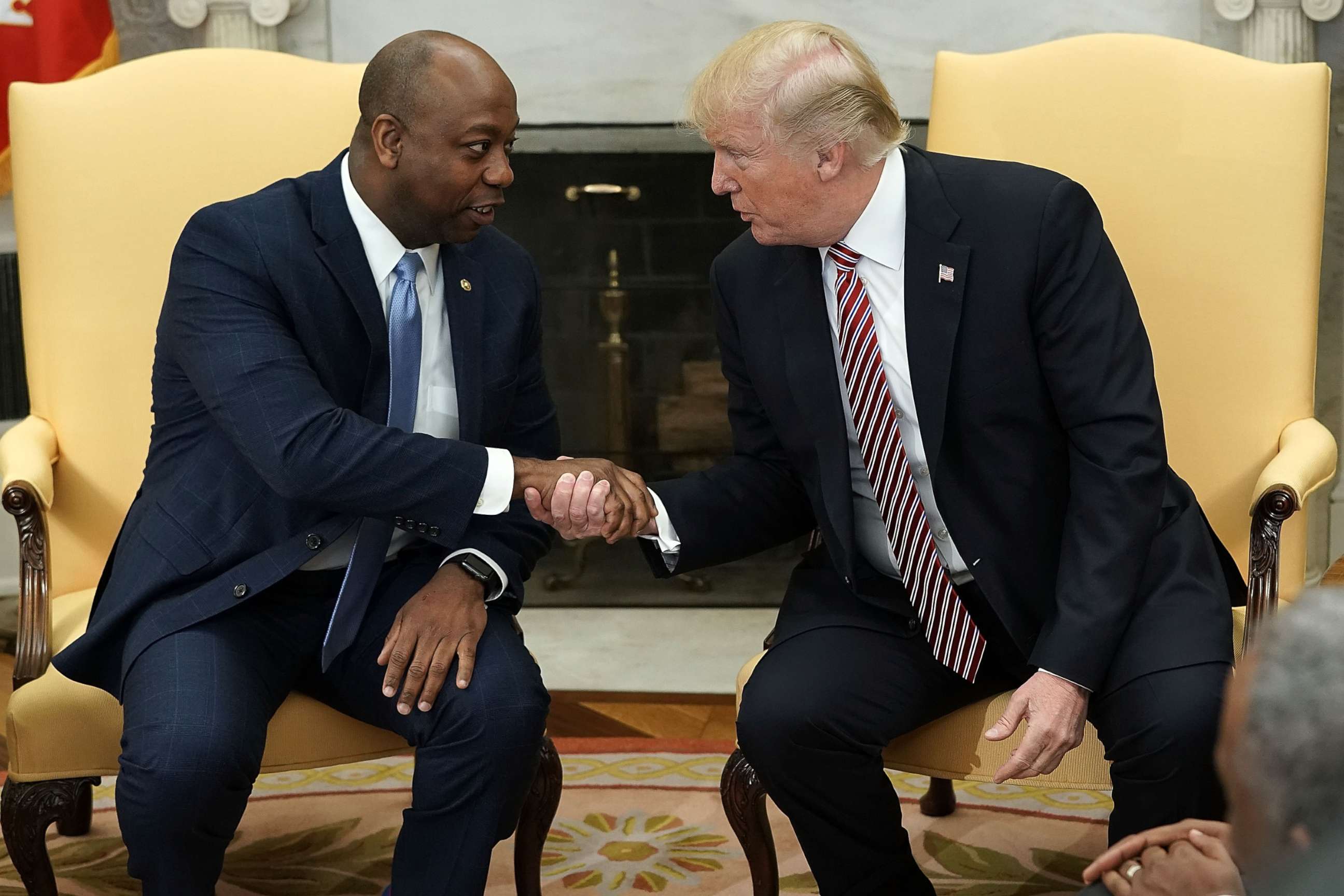 PHOTO: President Donald Trump shakes hands with Sen. Tim Scott (R-SC) during a working session regarding the Opportunity Zones provided by tax reform in the Oval Office of the White House, Feb.  14, 2018.