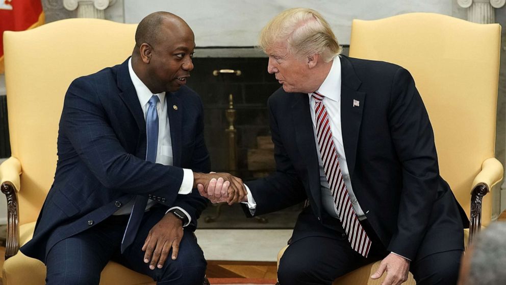 PHOTO: President Donald Trump shakes hands with Sen. Tim Scott (R-SC) during a working session regarding the Opportunity Zones provided by tax reform in the Oval Office of the White House, Feb.  14, 2018.