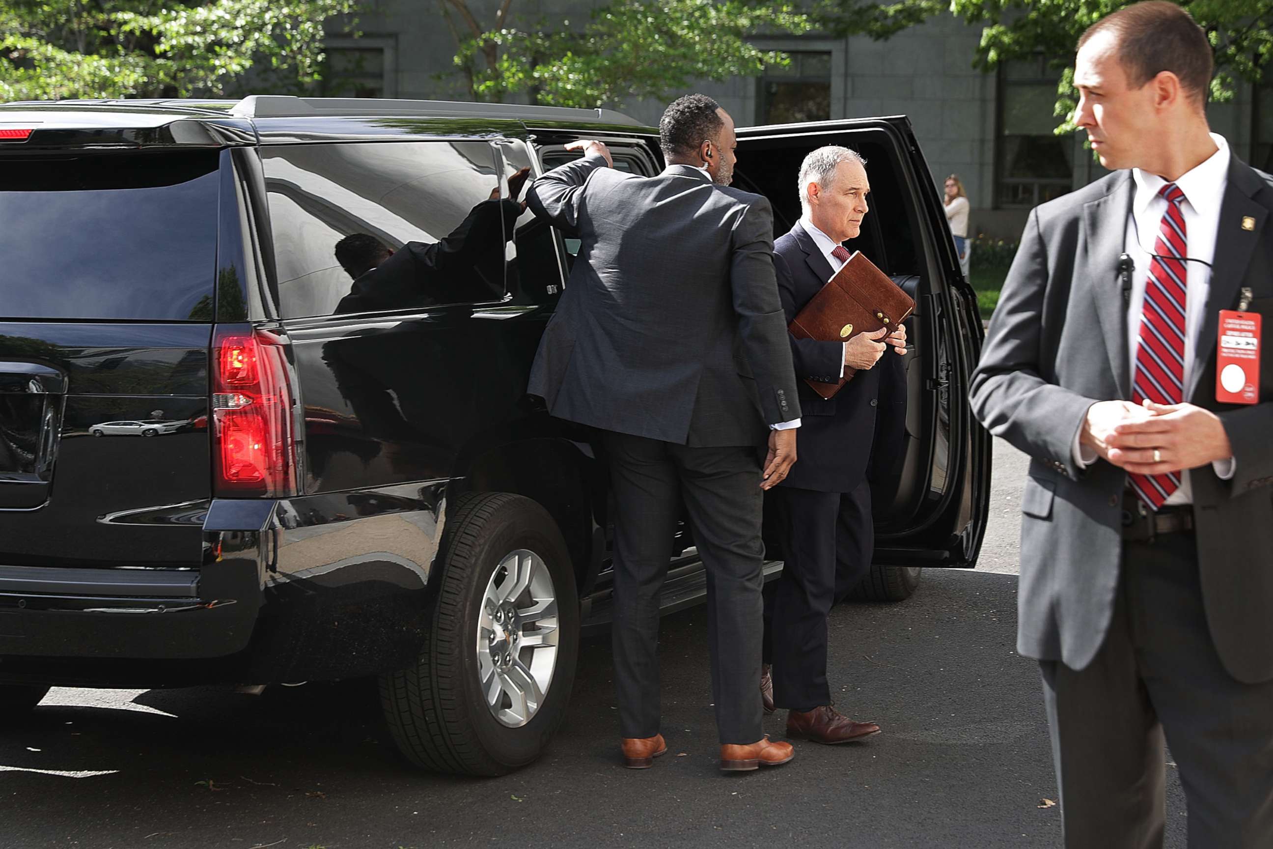 PHOTO: Surrounded by security agents, EPA Administrator Scott Pruitt steps out of his armored SUV as he arrives to testify before the House Energy and Commerce Committee's Environment Subcommittee on Capitol Hill April 26, 2018 in Washington.