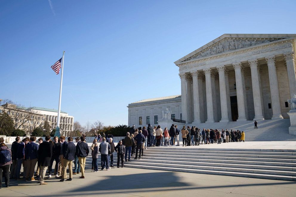 PHOTO: Members of the public wait in line outside the U.S. Supreme Court for a chance to hear oral arguments inside the court on March 2, 2020 in Washington.