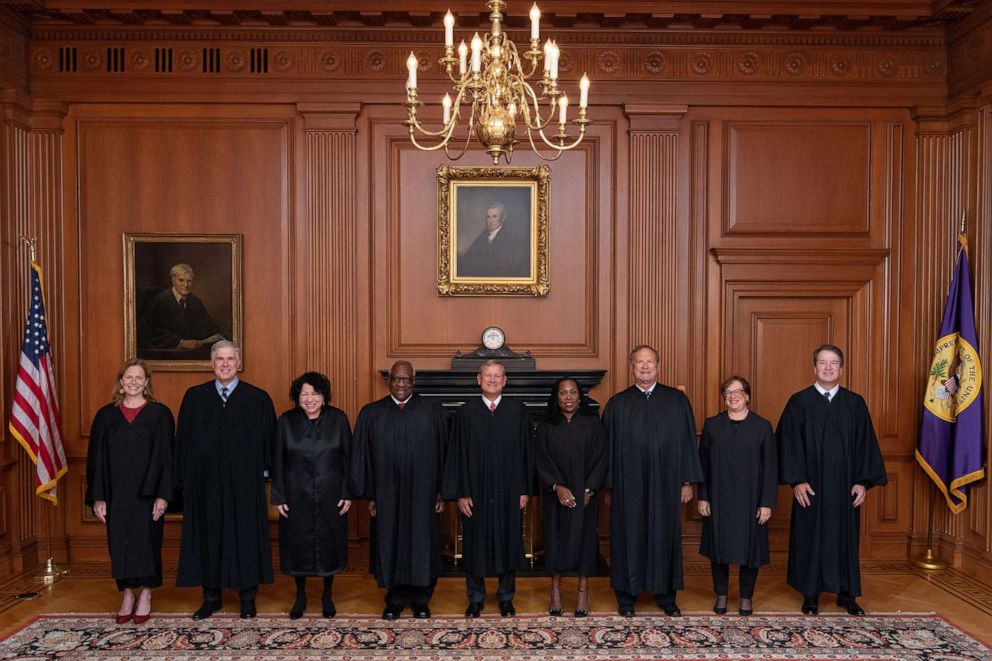 PHOTO: Supreme Court Justices Ketanji Brown Jackson stands with Associate Justices Amy Coney Barrett, Neil M. Gorsuch, Sonia Sotomayor, and Clarence Thomas, John G. Roberts, Jr., and  Samuel A. Alito, Jr., Elena Kagan, and Brett M. Kavanaugh.