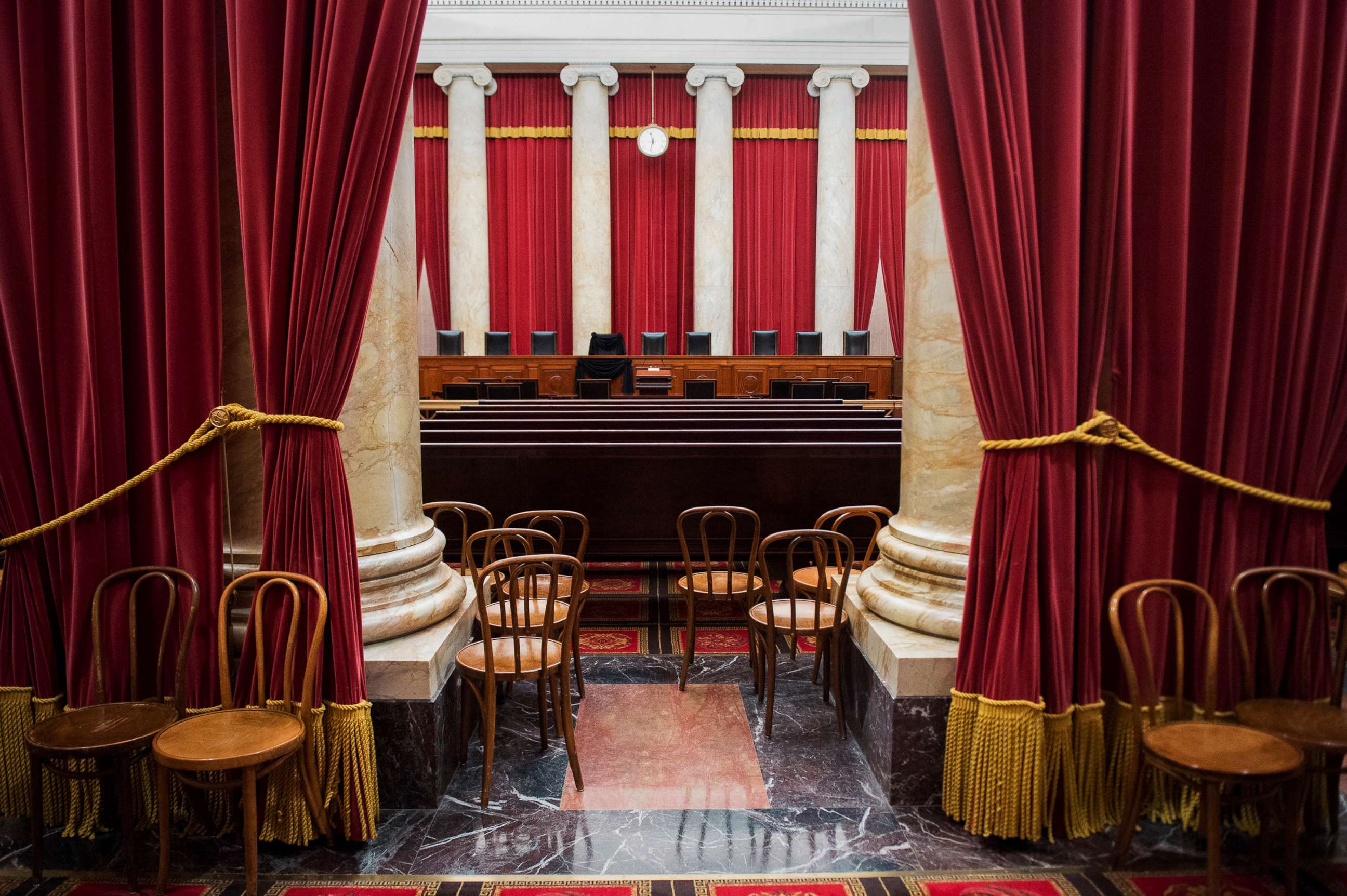 PHOTO: The nine chairs for justices of the Supreme Court with Justice Antonin Scalia's seat draped in black, Feb. 16, 2016, following his death on Feb. 13, 2016.