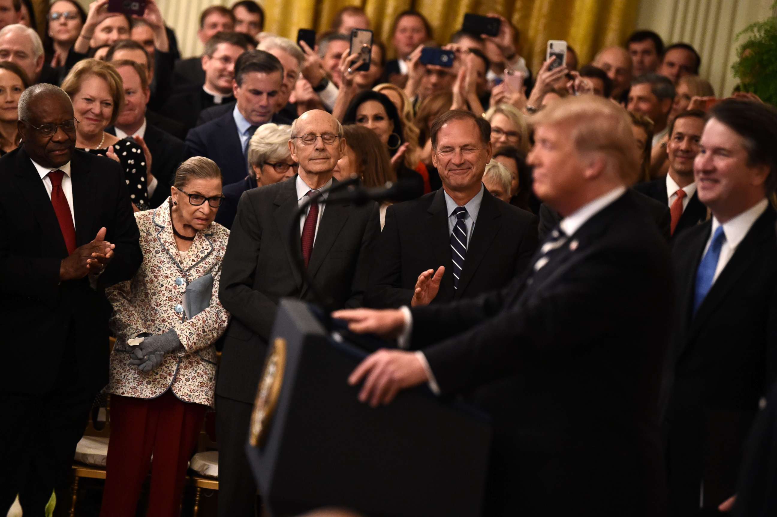 PHOTO: Supreme Court Associate Justices Clarence Thomas, Ruth Bader Ginsburg, Stephen Breyer and Samuel Alito listen as President Trump speaks during the swearing-in of Brett Kavanaugh as Associate Justice in Washington, Oct. 8, 2018. 