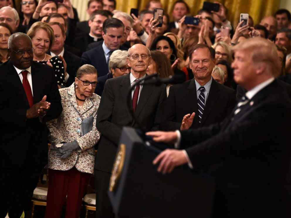 PHOTO: Supreme Court Associate Justices Clarence Thomas, Ruth Bader Ginsburg, Stephen Breyer and Samuel Alito listen as President Trump speaks during the swearing-in of Brett Kavanaugh as Associate Justice in Washington, Oct. 8, 2018.