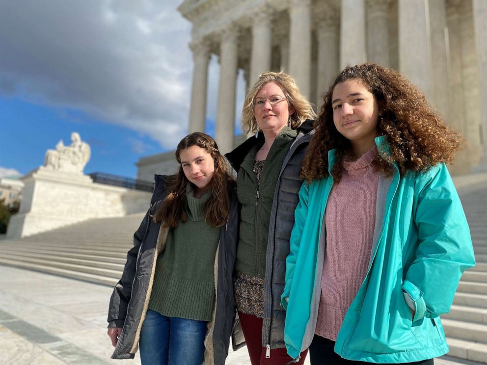 PHOTO: Montana resident Kendra Espinoza,center, a key plaintiff in a major religious rights case to be argued before the U.S. Supreme Court, poses in front of the white marble court building with her daughters in Washington, Jan. 19, 2020.