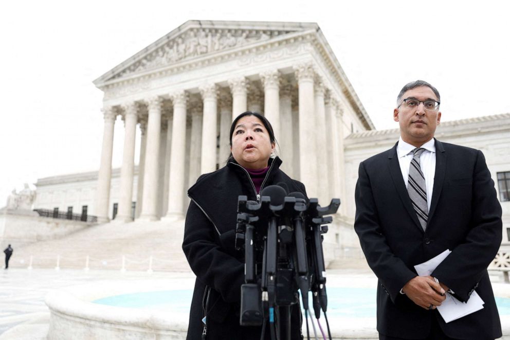 PHOTO: Kathay Feng and attorney Neal Katyal, speak to the media following oral arguments in Moore v. Harper, a Republican-backed appeal to curb judicial oversight of elections, in Washington, Dec. 7, 2022.