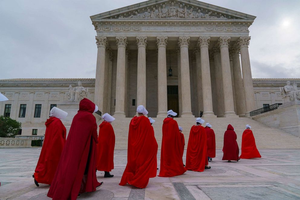 PHOTO: Activists opposed to the confirmation of President Donald Trump's Supreme Court nominee, Judge Amy Coney Barrett, are dressed as characters from "The Handmaid's Tale," at the Supreme Court on Capitol Hill in Washington, Oct. 11, 2020.