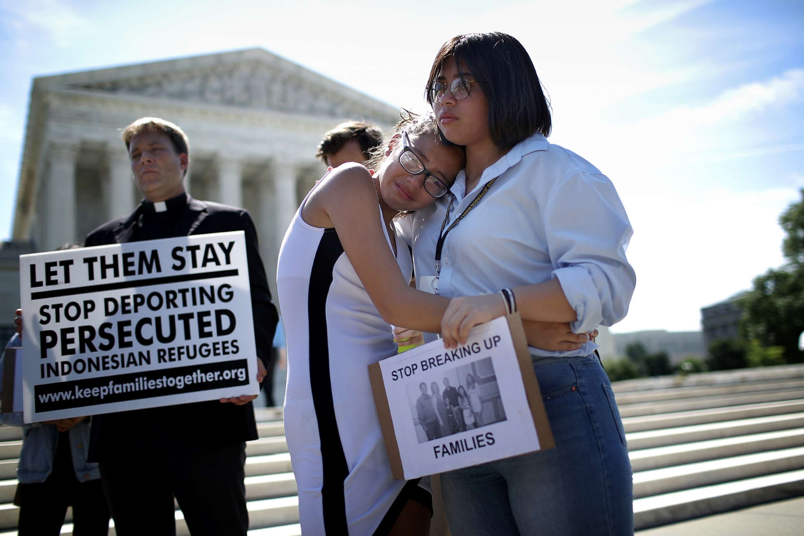 PHOTO: Sisters Michelle Edralin and Nicole Edralin, right, from Highland Park, console one another outside the U.S. Supreme Court as the court issued an immigration ruling June 26, 2018 in Washington, D.C., upholding President Trump's travel ban.