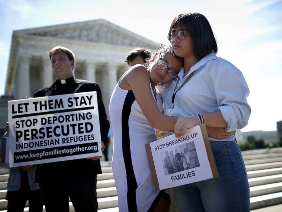 PHOTO: Sisters Michelle Edralin and Nicole Edralin, right, from Highland Park, console one another outside the U.S. Supreme Court as the court issued an immigration ruling June 26, 2018 in Washington, D.C., upholding President Trumps travel ban.