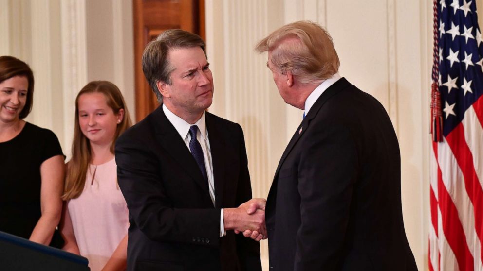 PHOTO: Supreme Court nominee Brett Kavanaugh shakes hands with President Donald Trump after he announced his nomination in the East Room of the White House on July 9, 2018 in Washington.