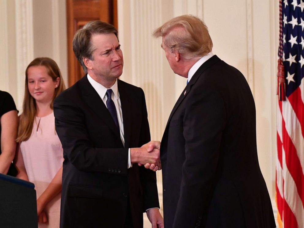 PHOTO: Supreme Court nominee Brett Kavanaugh shakes hands with President Donald Trump after he announced his nomination in the East Room of the White House on July 9, 2018 in Washington.