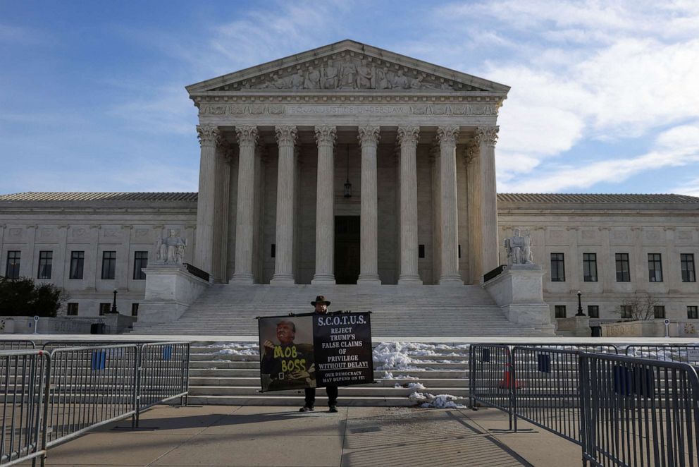 PHOTO: Stephen Parlato holds a sign outside the U.S. Supreme Court building in Washington, D.C., Jan. 19, 2022.