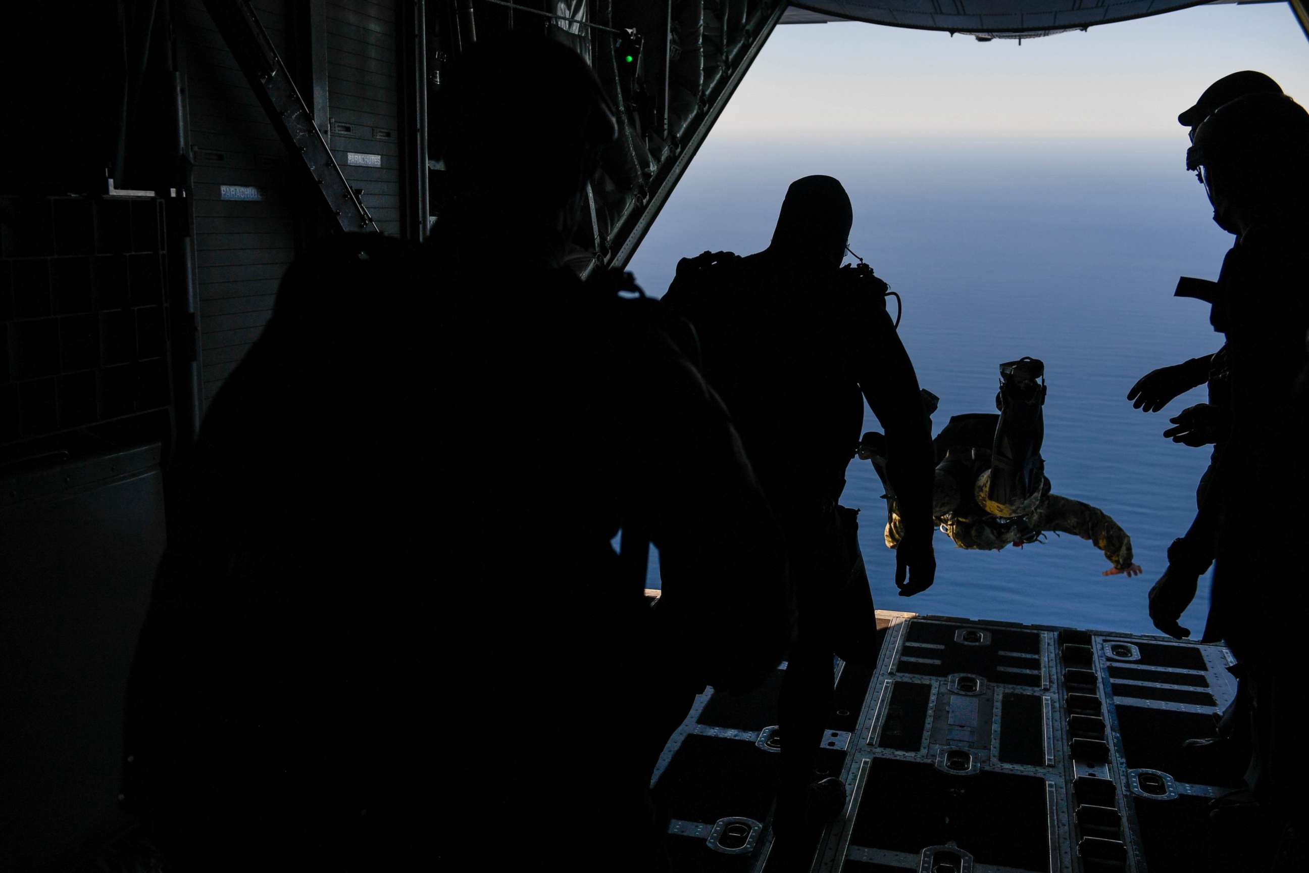 PHOTO: SEAL Team 7 members jump from an MC-130J Commando II during Emerald Warrior/Trident at Naval Air Station North Island, Calif., Jan. 19, 2019. Three SEAL Team 7 leaders were relieved of duty on Friday.